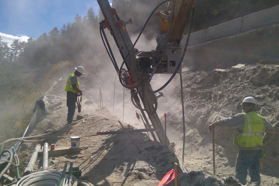 Park Range crew drilling micropiles in a trench at the Crawford Gulch MSE wall project