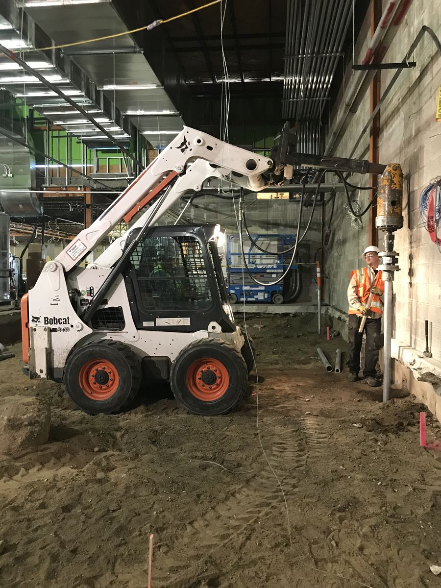 Park Range crew installing a helical pile inside Denver Health
